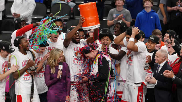 KANSAS CITY, MISSOURI - MARCH 14: The Arizona Wildcats celebrate after winning the Big 12 Tournament over the Houston Cougars at T-Mobile Center on March 14, 2026 in Kansas City, Missouri.
