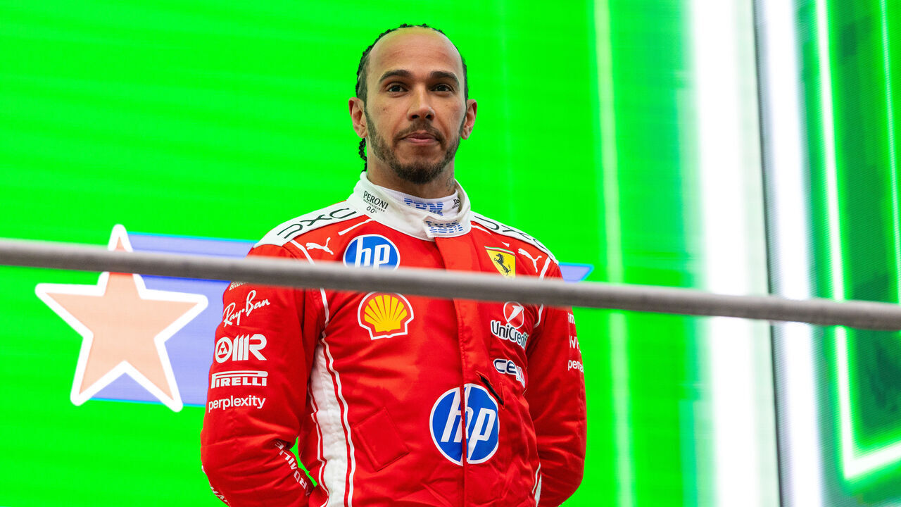SHANGHAI, CHINA - MARCH 15: Lewis Hamilton of Great Britain and Scuderia Ferrari looks on on the podium during the F1 Grand Prix of China at Shanghai International Circuit on March 15, 2026 in Shanghai, China.