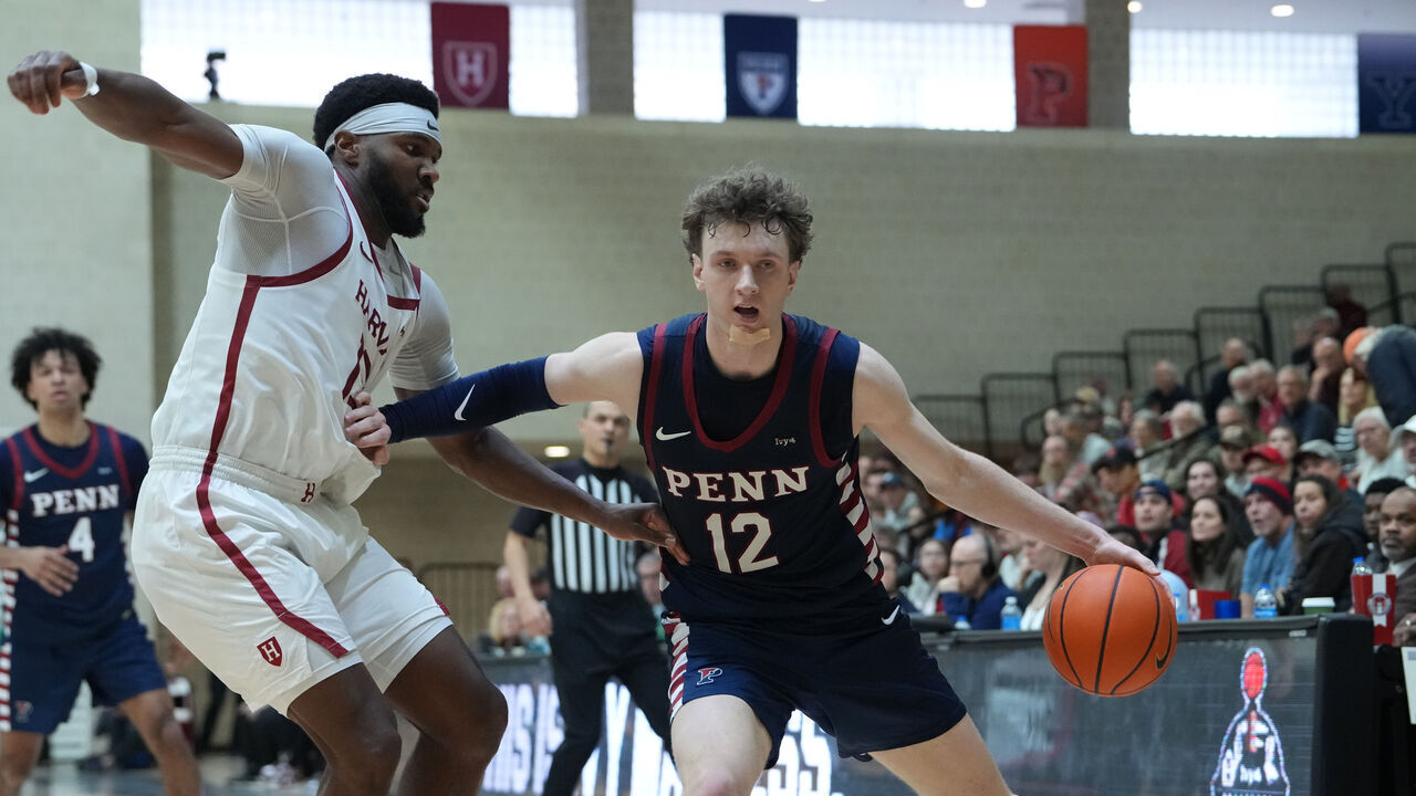 ITHACA, NY - MARCH 14: Pennsylvania Quakers Forward TJ Power (12) dribbles the ball against Harvard Crimson Guard Chandler Pigge (13) during the second half of the Ivy League Semi-Final game between the Pennsylvania Quakers and the Harvard Crimson on March 14, 2026, at Newman Arena in Ithaca, NY.