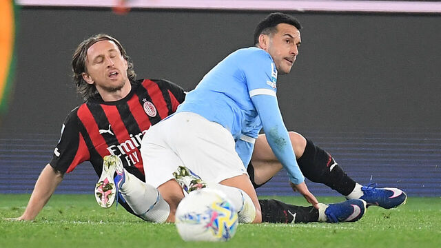ROME, ITALY - MARCH 15: Pedro Rodriguez of SS Lazio compete for the ball with Luka Modric of AC Milan during the Serie A match between SS Lazio and AC Milan at Stadio Olimpico on March 15, 2026 in Rome, Italy.