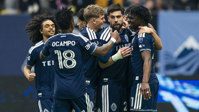 VANCOUVER, CANADA - MARCH 15: Brian White #24 of the Vancouver Whitecaps FC celebrates with teammates Edier Ocampo #18, Mihail Gherasimencov #29 and Emmanuel Sabbi #11 after scoring a goal against the Minnesota United during the second half of MLS action at BC Place on March 15, 2026 in Vancouver, Canada.