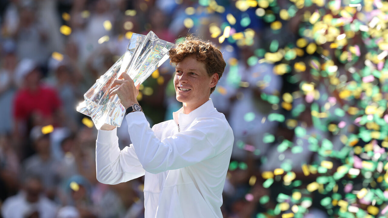 INDIAN WELLS, CALIFORNIA - MARCH 15: Jannik Sinner of Italy hoists the championship trophy after defeating Daniil Medvedev during their Men's Singles Finals match on Day 12 of the BNP Paribas Open at Indian Wells Tennis Garden on March 15, 2026 in Indian Wells, California.