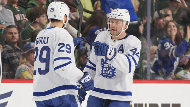 SAINT PAUL, MN - MARCH 15: Benoit-Olivier Groulx #29 celebrates his goal with his teammate Morgan Rielly #44 of the Toronto Maple Leafs during the game against the Minnesota Wild at Grand Casino Arena on March 15, 2026 in Saint Paul, Minnesota.