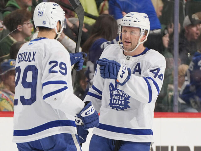 SAINT PAUL, MN - MARCH 15: Benoit-Olivier Groulx #29 celebrates his goal with his teammate Morgan Rielly #44 of the Toronto Maple Leafs during the game against the Minnesota Wild at Grand Casino Arena on March 15, 2026 in Saint Paul, Minnesota.