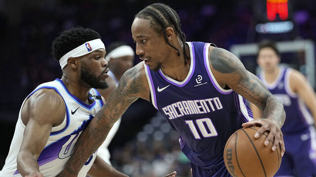 SACRAMENTO, CALIFORNIA - MARCH 15: DeMar DeRozan #10 of the Sacramento Kings dribbling the ball is guarded by Elijah Harkless #16 of the Utah Jazz in the second half at Golden 1 Center on March 15, 2026 in Sacramento, California.