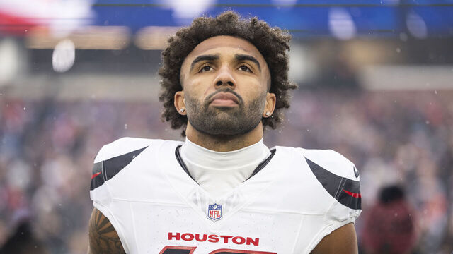 FOXBOROUGH, MASSACHUSETTS - JANUARY 18: Christian Kirk #13 of the Houston Texans looks on during the national anthem prior to an NFC Divisional Playoff game against the New England Patriots at Gillette Stadium on January 18, 2026 in Foxborough, Massachusetts.