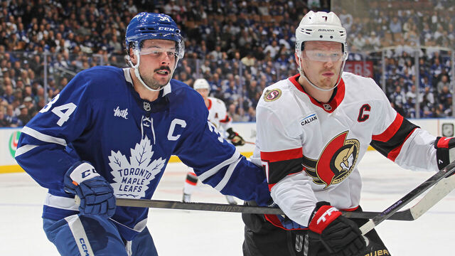 TORONTO, CANADA - APRIL 22: Brady Tkachuk #7 of the Ottawa Senators skates against Auston Matthews #34 of the Toronto Maple Leafs during the first period in Game Two of the First Round of the 2025 Stanley Cup Playoffs at Scotiabank Arena on April 22, 2025 in Toronto, Ontario, Canada.