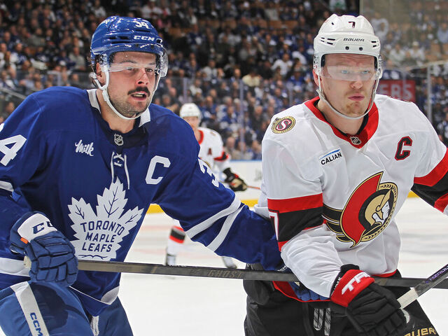 TORONTO, CANADA - APRIL 22: Brady Tkachuk #7 of the Ottawa Senators skates against Auston Matthews #34 of the Toronto Maple Leafs during the first period in Game Two of the First Round of the 2025 Stanley Cup Playoffs at Scotiabank Arena on April 22, 2025 in Toronto, Ontario, Canada.