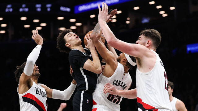 NEW YORK, NEW YORK - MARCH 16: Nolan Traore #88 of the Brooklyn Nets is defended by Toumani Camara #33 and Donovan Clingan #23 and Matisse Thybulle #4 of the Portland Trail Blazers during the second quarter of the game at Barclays Center on March 16, 2026 in New York City.