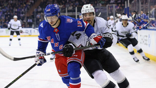 NEW YORK, NEW YORK - MARCH 16: Urho Vaakanainen #18 of the New York Rangers and Alex Laferriere #14 of the Los Angeles Kings battle for position during the first period at Madison Square Garden on March 16, 2026 in New York City.