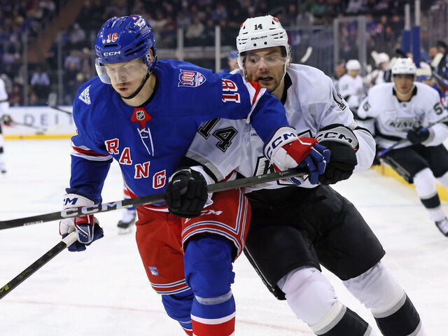 NEW YORK, NEW YORK - MARCH 16: Urho Vaakanainen #18 of the New York Rangers and Alex Laferriere #14 of the Los Angeles Kings battle for position during the first period at Madison Square Garden on March 16, 2026 in New York City.