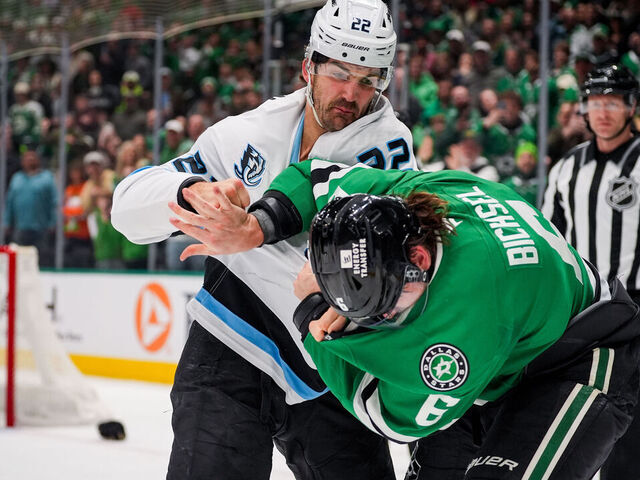 DALLAS, TEXAS - MARCH 16: Jack McBain #22 of the Utah Mammoth fights against Lian Bichsel #6 of the Dallas Stars during the first period at American Airlines Center on March 16, 2026 in Dallas, Texas.