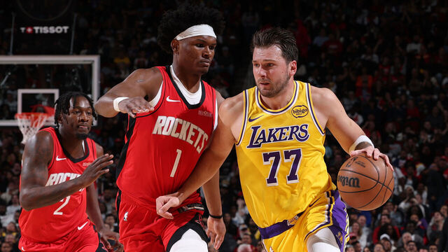HOUSTON, TX - MARCH 16: Luka Doncic #77 of the Los Angeles Lakers is guarded by Amen Thompson #1 of the Houston Rockets on March 16, 2026 at Toyota Center in Houston, Texas. Mandatory Copyright Notice: Copyright 2026 NBAE