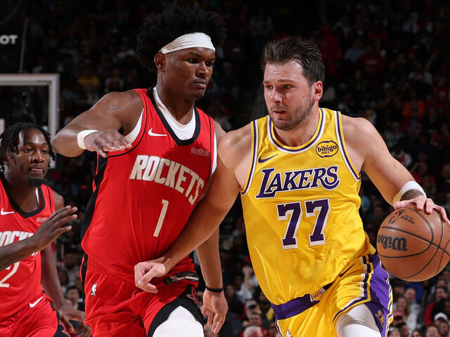 HOUSTON, TX - MARCH 16: Luka Doncic #77 of the Los Angeles Lakers is guarded by Amen Thompson #1 of the Houston Rockets on March 16, 2026 at Toyota Center in Houston, Texas. Mandatory Copyright Notice: Copyright 2026 NBAE