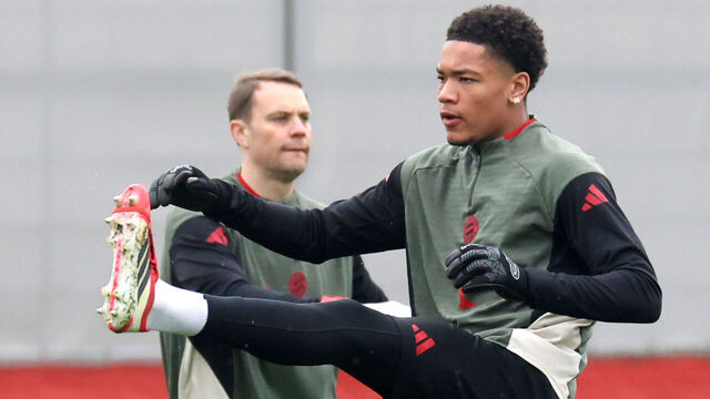 MUNICH, GERMANY - MARCH 17: Leonard Prescott of FC Bayern München warms-up next to his team mate Manuel Neuer during a training session at Bayern Munich trainings Ground Saebener Strasse prior their UEFA Champions League 2025/26 round of 16 second leg match on March 17, 2026 in Munich, Germany.
