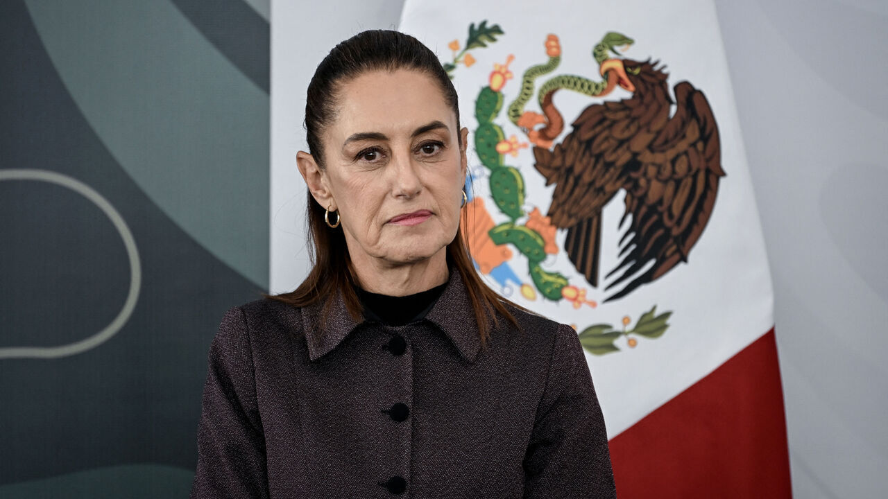 Mexico's President Claudia Sheinbaum looks on during her daily press conference at the Women's Oncology Hospital in Mexico City on March 9, 2026. Mexican President Claudia Sheinbaum called on March 9 on the United States to halt the flow of weapons to her country's drug cartels, after President Donald Trump criticized her record on fighting the groups.