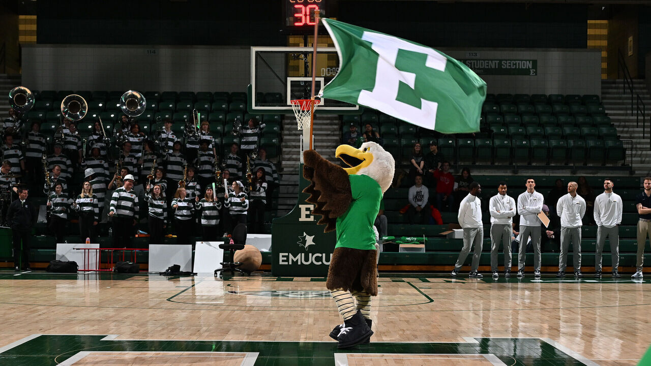 YPSILANTI, MI - FEBRUARY 15: Eastern Michigan Eagles mascot Swoop waves the team flag prior to team introductions for the Eastern Michigan Eagles vs the Toledo Rockets game on Saturday February 15, 2025 at George Gervin GameAbove Center in Ypsilanti, MI.