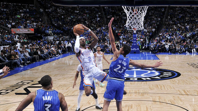 ORLANDO, FL - MARCH 17: Shai Gilgeous-Alexander #2 of the Oklahoma City Thunder drives to the basket as Tristan da Silva #23 of the Orlando Magic plays defense during the game on March 17, 2026 at Kia Center in Orlando, Florida. Mandatory Copyright Notice: Copyright 2026 NBAE