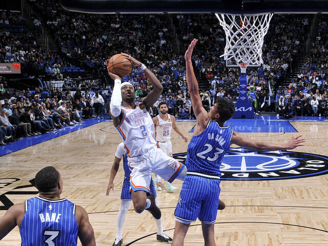 ORLANDO, FL - MARCH 17: Shai Gilgeous-Alexander #2 of the Oklahoma City Thunder drives to the basket as Tristan da Silva #23 of the Orlando Magic plays defense during the game on March 17, 2026 at Kia Center in Orlando, Florida. Mandatory Copyright Notice: Copyright 2026 NBAE