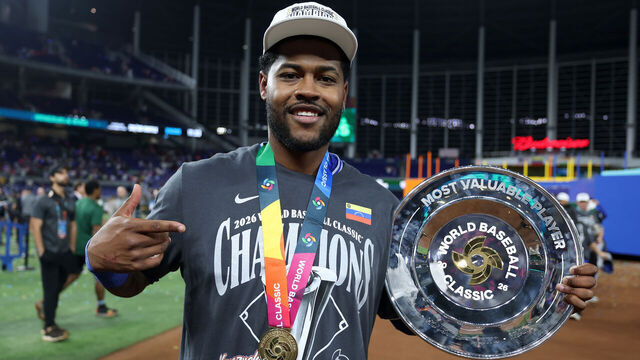 MIAMI, FLORIDA - MARCH 17: Maikel Garcia #11 of Team Venezuela poses with the MVP trophy after the 3-2 victory against Team United States at loanDepot park on March 17, 2026 in Miami, Florida.
