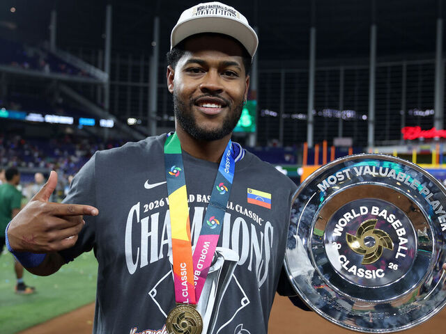 MIAMI, FLORIDA - MARCH 17: Maikel Garcia #11 of Team Venezuela poses with the MVP trophy after the 3-2 victory against Team United States at loanDepot park on March 17, 2026 in Miami, Florida.