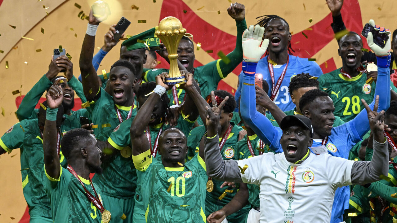 TOPSHOT - Senegal's forward #10 Sadio Mane holds the trophy after the Africa Cup of Nations (CAN) final football match between Senegal and Morocco at the Prince Moulay Abdellah Stadium in Rabat on January 18, 2026.