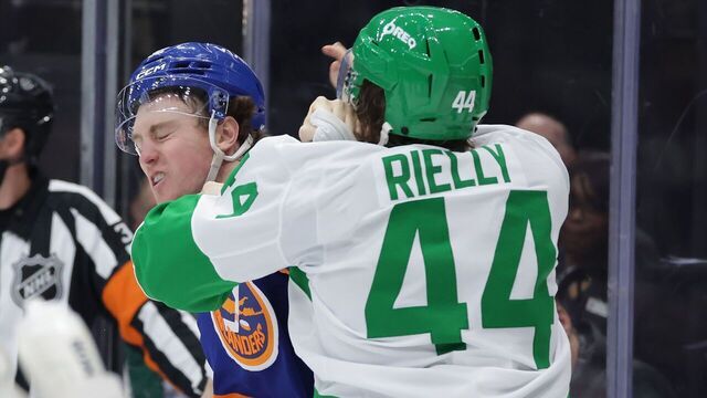 TORONTO, ON- MARCH 17 - Defenseman Morgan Rielly #44 of the Toronto Maple Leafs and center Kyle MacLean #32 of the New York Islanders fight in the second period as the Toronto Maple Leafs play the New York Islanders at Scotiabank Arena in Toronto. March 17, 2026. Steve Russell/Toronto Star (Steve Russell/Toronto Star via Getty Images)
