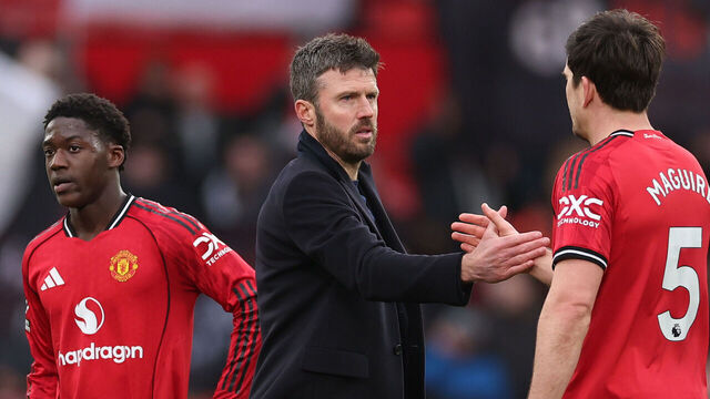 MANCHESTER, ENGLAND - MARCH 15: Michael Carrick Head Coach of Manchester United shakes hands with Harry Maguire after the Premier League match between Manchester United and Aston Villa at Old Trafford on March 15, 2026 in Manchester, England.