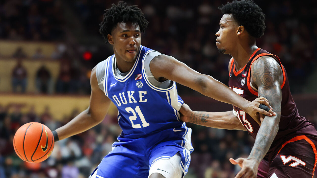 BLACKSBURG, VIRGINIA - JANUARY 31: Patrick Ngongba II #21 of the Duke Blue Devils drives against Amani Hansberry #13 of the Virginia Tech Hokies in the second half during a game at Cassell Coliseum on January 31, 2026 in Blacksburg, Virginia.