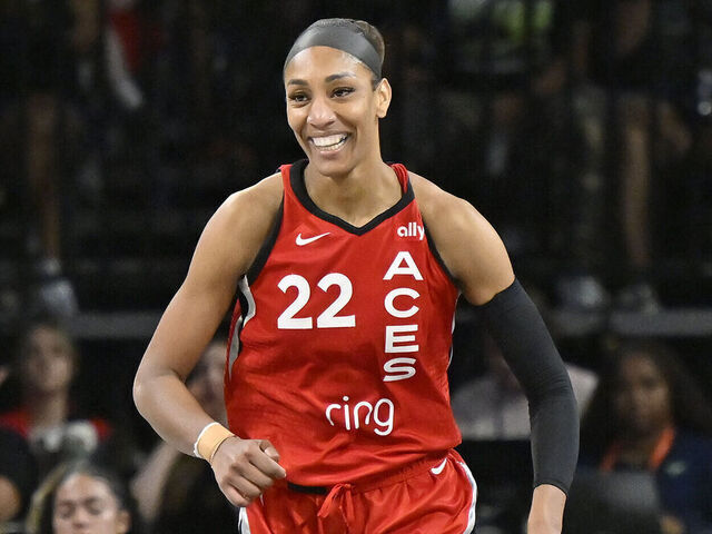 LAS VEGAS, NV - AUGUST 17: A'ja Wilson #22 of the Las Vegas Aces smiles during the game against the Dallas Wings on August 17, 2025 at Michelob ULTRA Arena in Las Vegas, Nevada. Mandatory Copyright Notice: Copyright 2025 NBAE