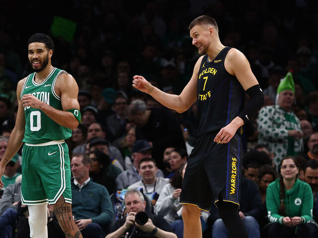 BOSTON, MA - MARCH 18: Kristaps Porzingis #7 of the Golden State Warriors shares a laugh with former teammate Jayson Tatum #0 of the Boston Celtics during the second half at TD Garden on March 18, 2026 in Boston, Massachusetts. NOTE TO USER: User expressly acknowledges and agrees that, by downloading and/or using this Photograph, user is consenting to the terms and conditions of the Getty Images License Agreement.