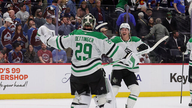 DENVER, COLORADO - MARCH 18: Goaltender Jake Oettinger #29 and Nathan Bastian #11 of the Dallas Stars celebrate after a shootout win against the Colorado Avalanche at Ball Arena on March 18, 2026 in Denver, Colorado.