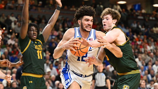 GREENVILLE, SOUTH CAROLINA - MARCH 19: Riley Mulvey #55 of the Siena Saints fouls Cameron Boozer #12 of the Duke Blue Devils during the first round of the 2026 NCAA Men's Basketball Tournament held at Bon Secours Wellness Arena on March 19, 2026 in Greenville, South Carolina.