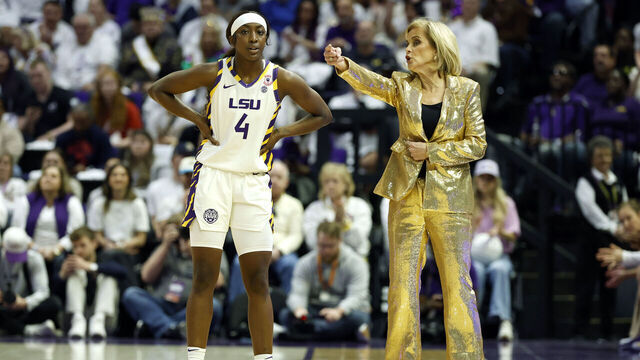 BATON ROUGE, LOUISIANA - JANUARY 11: Head coach Kim Mulkey of the LSU Tigers (R) speaks with Flau'jae Johnson #4 during the first half of a game against the Texas Longhorns at Pete Maravich Assembly Center on January 11, 2026 in Baton Rouge, Louisiana.