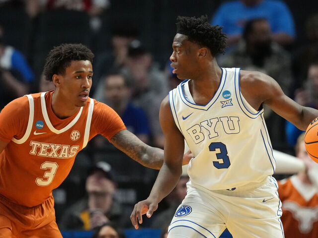 PORTLAND, OREGON - MARCH 19: AJ Dybantsa #3 of the BYU Cougars dribbles the ball while being guarded by Dailyn Swain #3 of the Texas Longhorns during the first half in the first round of the 2026 NCAA Men's Basketball Tournament at Moda Center on March 19, 2026 in Portland, Oregon.