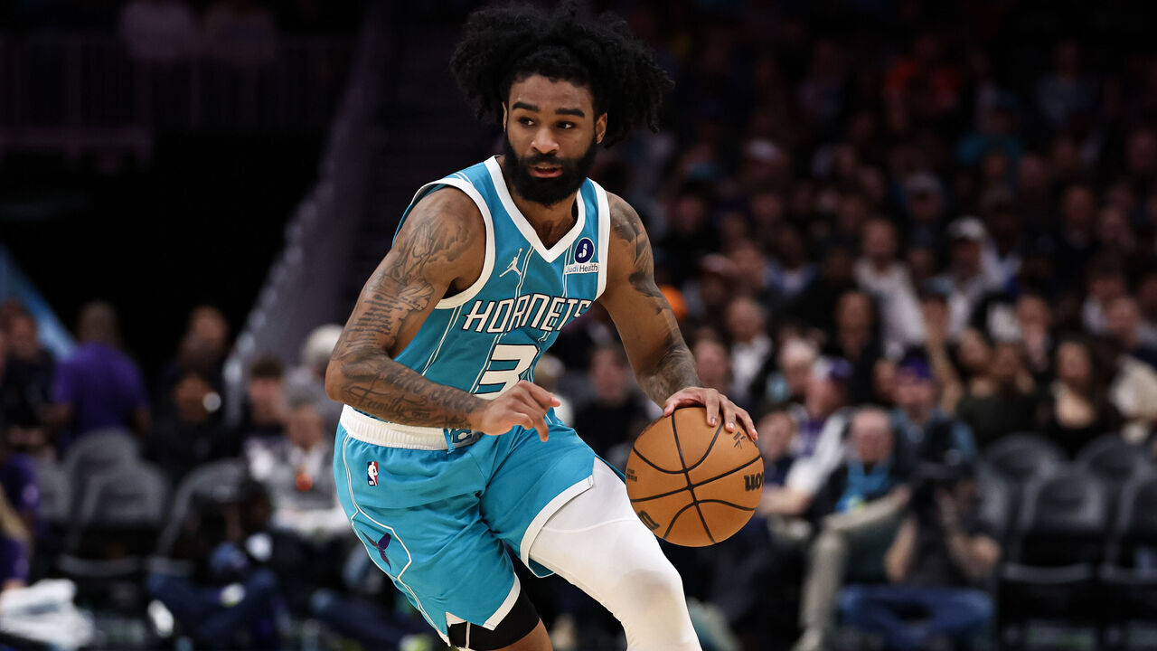 CHARLOTTE, NORTH CAROLINA - MARCH 19: Coby White #3 of the Charlotte Hornets dribbles the ball to the basket during the first half of the basketball game against the Orlando Magic at Spectrum Center on March 19, 2026 in Charlotte, North Carolina.