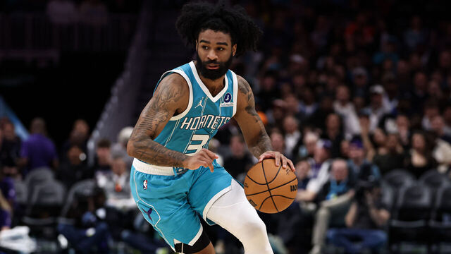 CHARLOTTE, NORTH CAROLINA - MARCH 19: Coby White #3 of the Charlotte Hornets dribbles the ball to the basket during the first half of the basketball game against the Orlando Magic at Spectrum Center on March 19, 2026 in Charlotte, North Carolina.