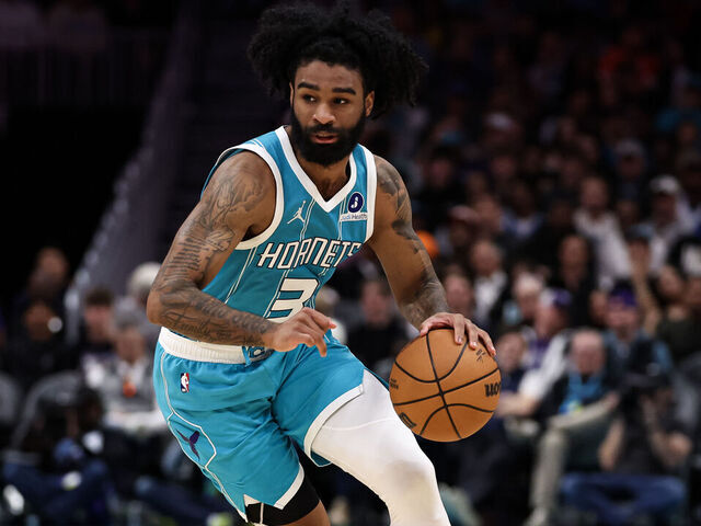 CHARLOTTE, NORTH CAROLINA - MARCH 19: Coby White #3 of the Charlotte Hornets dribbles the ball to the basket during the first half of the basketball game against the Orlando Magic at Spectrum Center on March 19, 2026 in Charlotte, North Carolina.