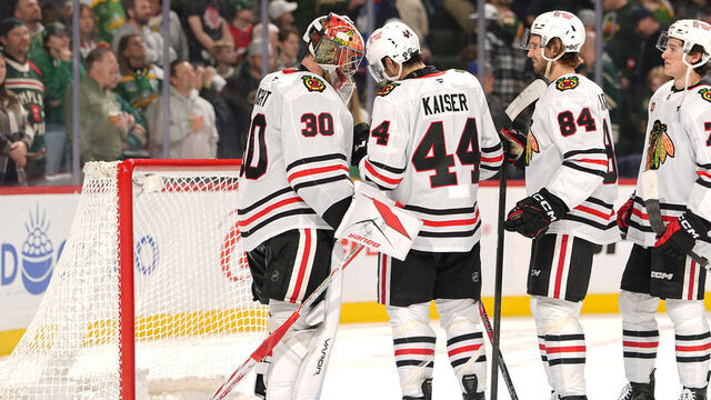 SAINT PAUL, MN - MARCH 19: Spencer Knight #30, Wyatt Kaiser #44 and Landon Slaggert #84 of the Chicago Blackhawks celebrate after defeating the Minnesota Wild at Grand Casino Arena on March 19, 2026 in Saint Paul, Minnesota.
