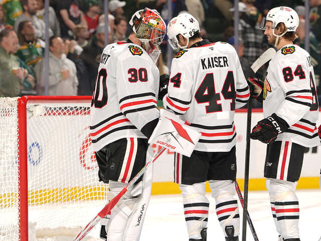 SAINT PAUL, MN - MARCH 19: Spencer Knight #30, Wyatt Kaiser #44 and Landon Slaggert #84 of the Chicago Blackhawks celebrate after defeating the Minnesota Wild at Grand Casino Arena on March 19, 2026 in Saint Paul, Minnesota.