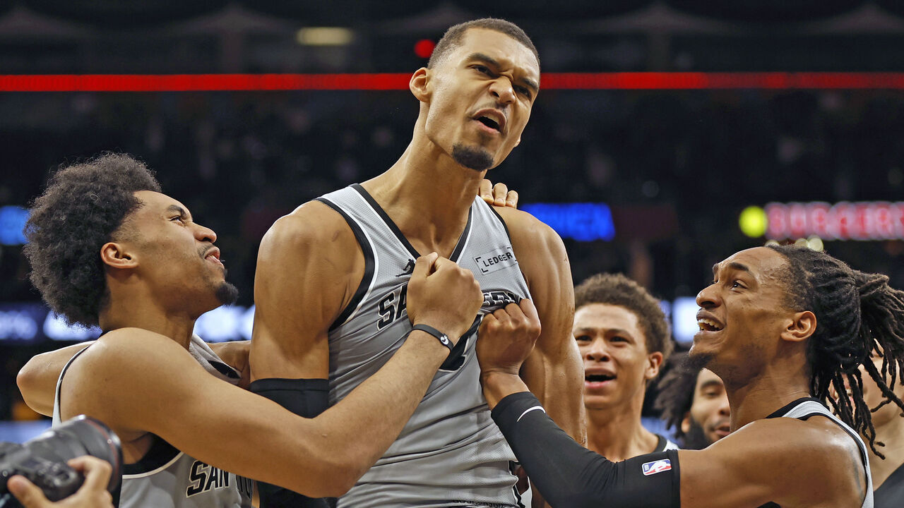 SAN ANTONIO, TEXAS - MARCH 19: Victor Wembanyama #1 of the San Antonio Spurs is surrounded by teammates after he scored the game-winning basket against the Phoenix Suns at Frost Bank Center on March 19, 2026 in San Antonio, Texas. NOTE TO USER: User expressly acknowledges and agrees that, by downloading and or using this photograph, User is consenting to terms and conditions of the Getty Images License Agreement.