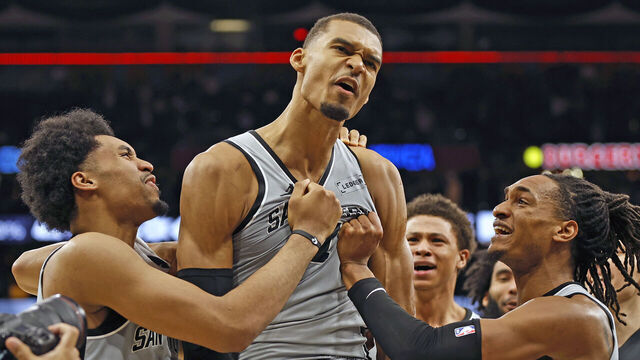 SAN ANTONIO, TEXAS - MARCH 19: Victor Wembanyama #1 of the San Antonio Spurs is surrounded by teammates after he scored the game-winning basket against the Phoenix Suns at Frost Bank Center on March 19, 2026 in San Antonio, Texas. NOTE TO USER: User expressly acknowledges and agrees that, by downloading and or using this photograph, User is consenting to terms and conditions of the Getty Images License Agreement.