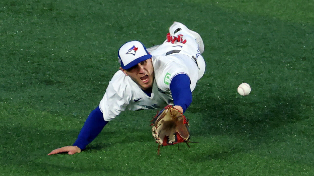 TORONTO, ONTARIO - NOVEMBER 01: Center fielder Daulton Varsho #5 of the Toronto Blue Jays makes a catch off the bat of right fielder Teoscar Hernández #37 of the Los Angeles Dodgers during the 4th inning of game seven of the 2025 World Series at Rogers Center on November 01, 2025 in Toronto, Ontario.