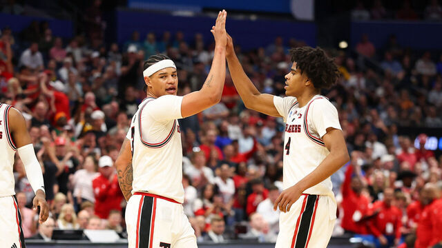 TAMPA, FLORIDA - MARCH 20: Christian Anderson #4 and LeJuan Watts #3 of the Texas Tech Red Raiders high five during the first half against the Akron Zips in the first round of the 2026 NCAA Men's Basketball Tournament at Benchmark International Arena on March 20, 2026 in Tampa, Florida.