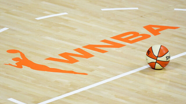 PALMETTO, FLORIDA - AUGUST 29: A basketball sits near the WNBA logo during a timeout of a game between the Las Vegas Aces and the New York Liberty at Feld Entertainment Center on August 29, 2020 in Palmetto, Florida.