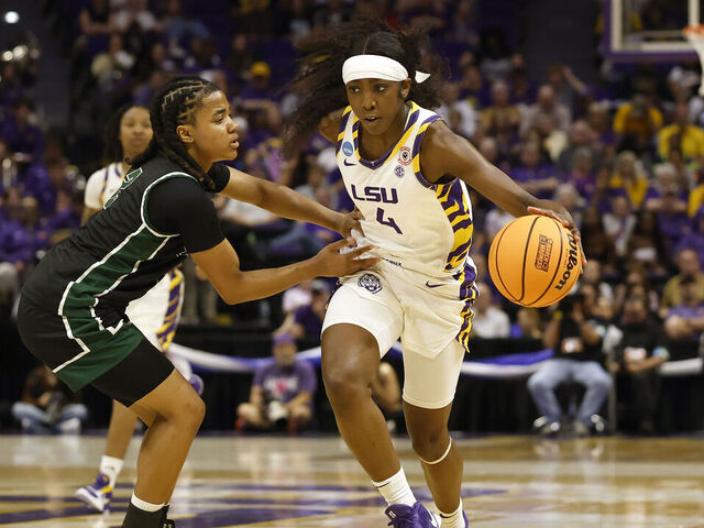 BATON ROUGE, LOUISIANA - MARCH 20: Flau'jae Johnson #4 of the LSU Tigers is defended by Tatum Brown #2 of the Jacksonville Dolphins during the first half in first round of the 2026 NCAA Women's Basketball Tournament at Pete Maravich Assembly Center on March 20, 2026 in Baton Rouge, Louisiana.