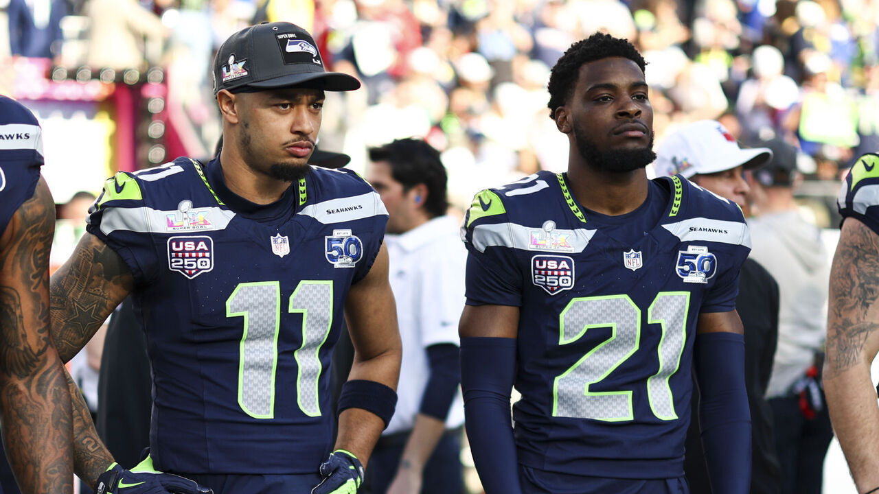 SANTA CLARA, CALIFORNIA - FEBRUARY 8: Leonard Williams #99, Jaxon Smith-Njigba #11, Devon Witherspoon #21# and Brady Russell #38 of the Seattle Seahawks stand on the sideline prior to the NFL Super Bowl LX football game against the New England Patriots, at Levi's Stadium on February 8, 2026 in Santa Clara, California.