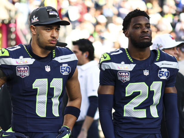 SANTA CLARA, CALIFORNIA - FEBRUARY 8: Leonard Williams #99, Jaxon Smith-Njigba #11, Devon Witherspoon #21# and Brady Russell #38 of the Seattle Seahawks stand on the sideline prior to the NFL Super Bowl LX football game against the New England Patriots, at Levi's Stadium on February 8, 2026 in Santa Clara, California.