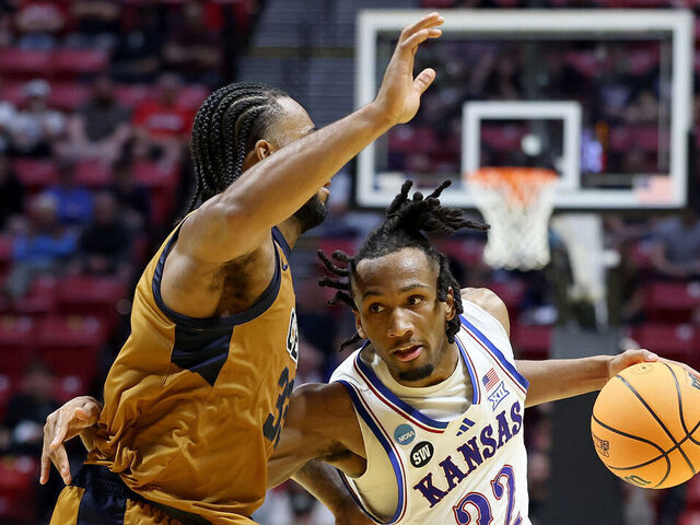 SAN DIEGO, CALIFORNIA - MARCH 20: Darryn Peterson #22 of the Kansas Jayhawks drives to the basket against Martel Williams #33 of the California Baptist Lancers during the second half of the game in the first round of the 2026 NCAA Men's Basketball Tournament at Viejas Arena at San Diego State University on March 20, 2026 in San Diego, California.