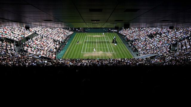 LONDON, ENGLAND - JULY 13: A general view over Centre Court as Carlos Alcaraz of Spain serves against Jannik Sinner of Italy during the Gentleman's Singles Final on day fourteen of The Championships Wimbledon 2025 at All England Lawn Tennis and Croquet Club on July 13, 2025 in London, England.